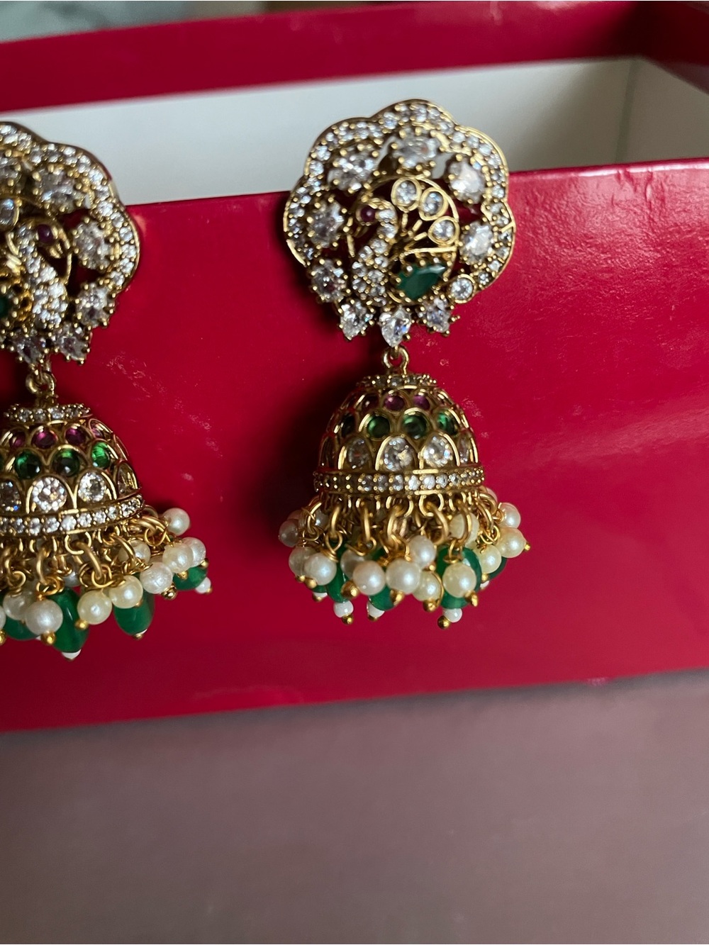Gold Drop Jhumka Earrings with Green and White Accents